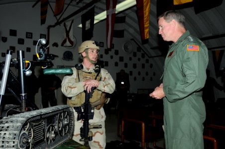 US Navy 100304-N-1906L-004 Adm. Patrick Walsh, right, commander of U.S. Pacific Fleet, listens to a brief by Explosive Ordnance Disposal Technician 1st Class Ryan Gilfillan