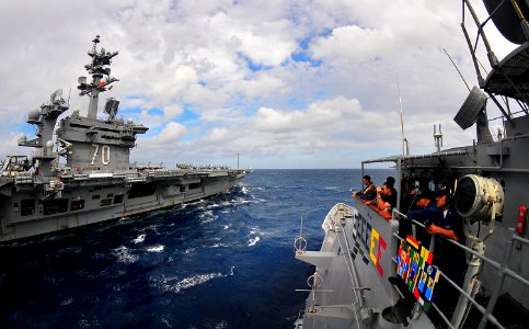US Navy 100304-N-4774B-221 Sailors standing the bridge watch aboard the guided-missile cruiser USS Bunker Hill (CG 52) observe their approach towards the Nimitz-class aircraft carrier USS Carl Vinson (CVN 70)