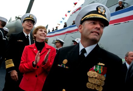 US Navy 100306-N-0696M-131 Chairman of the Joint Chiefs of Staff Adm. Mike Mullen, his wife, Deborah Mullen, and Cmdr. Warren R. Buller watch the crew bring Dewey to life during the ship's commissioning ceremony