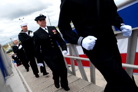 US Navy 100306-N-0696M-121 Sailors assigned to the Arleigh Burke-class guided-missile destroyer USS Dewey (DDG 105) bring the ship to life during the ship's commissioning ceremony