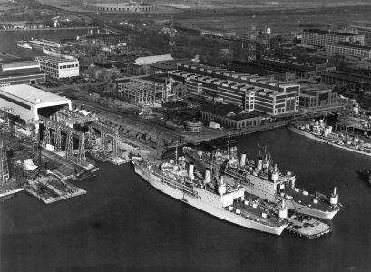 USS Albemarle (AV-5) and USS Curtiss (AV-4) fitting out at the Philadelphia Naval Shipyard in late 1940 (NH 96539)