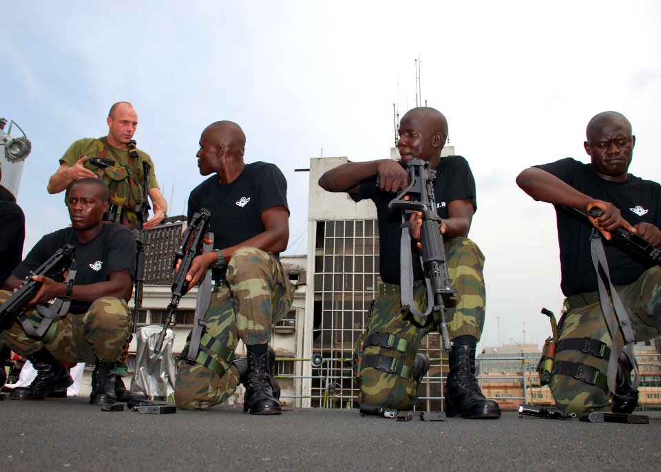 US Navy 100304-N-6138K-301 elgian navy Chief Warrant Officer Stulens Geoges teaches a weapons familiarization class on the Belgian FN FNC 5.56mm assault rifle