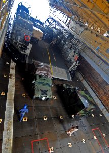 US Navy 100305-N-1082Z-051 Vehicles and equipment are off loaded from Landing Craft Air Cushion (LCAC) 67, assigned to Assault Craft Unit (ACU) 4, in the well deck of the amphibious dock landing ship USS Ashland (LSD 48) photo