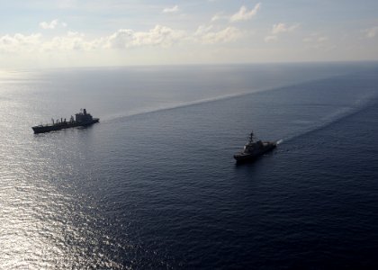 US Navy 100304-N-7088A-284 The Arleigh Burke-class guided-missile destroyer USS Farragut (DDG 99) is underway with the Military Sealift Command fleet replenishment oiler USNS Patuxent (T-AO 201)