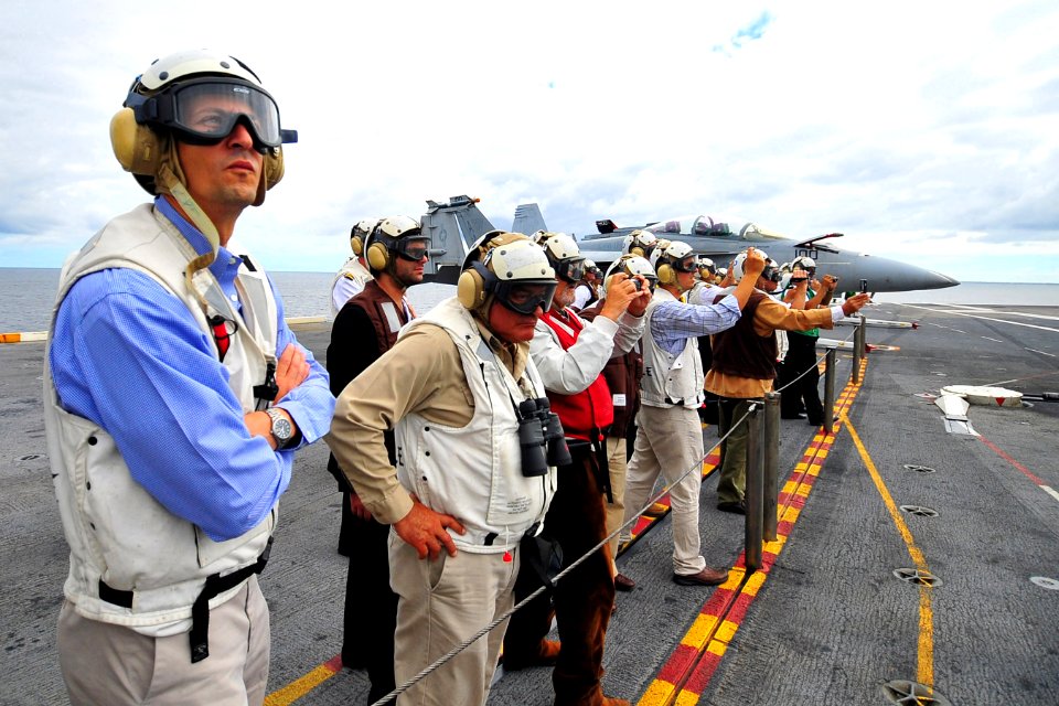 US Navy 100307-N-2953W-680 Luis Lacalle, second from left, former president of Uruguay, watches an F-A-18 Super Hornet land aboard the nuclear-powered aircraft carrier USS Carl Vinson (CVN 70)