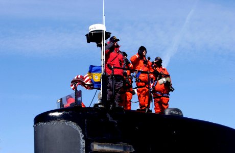 US Navy 100305-N-7705S-036 Cmdr. Douglas Jordan salutes as USS Norfolk (SSN 714) departs Naval Station Norfolk