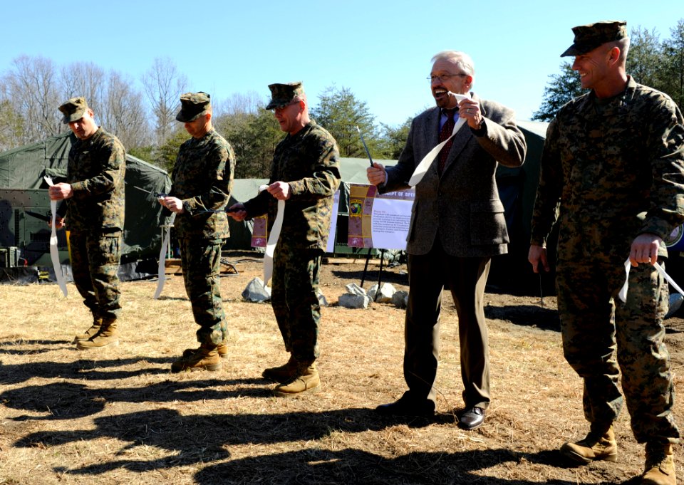 US Navy 100304-N-7676W-018 George Solhan, director of the Office of Naval Research, Expeditionary Maneuver Warfare ^ Combating Terrorism department, laughs during a ribbon-cutting ceremony
