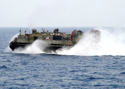 US Navy 100305-N-1082Z-073 Landing Craft Air Cushion (LCAC) 67, assigned to Assault Craft Unit (ACU) 4, departs the amphibious dock landing ship USS Ashland (LSD 48) photo