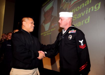US Navy 100305-N-4031K-050 Master-at-Arms 2nd Class Michael Nixon received the Veterans of Foreign War's National Life Saving Award for his efforts in helping to save the life of a Japanese woman