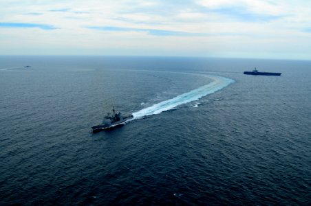 US Navy 100308-N-0808V-620 USS Bunker Hill (CG 52) and the Argentina navy frigate ARA Gomez Roca (P 46) break away from USS Carl Vinson (CVN 70) after completing tactical maneuvering exercises