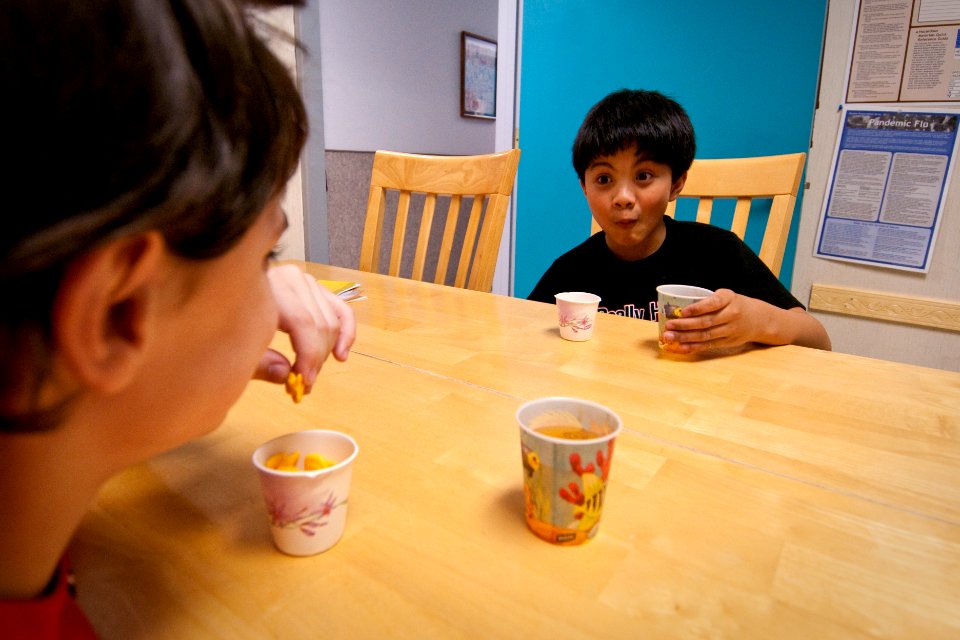 US Navy 100306-N-5319A-084 Ten-year-old Joseph Camano drinks juice with therapy patient nine-year-old Logan Flaathen after a routine physical therapy session at the Diane Epplein ^ Assoc. Pediatric Therapy facility
