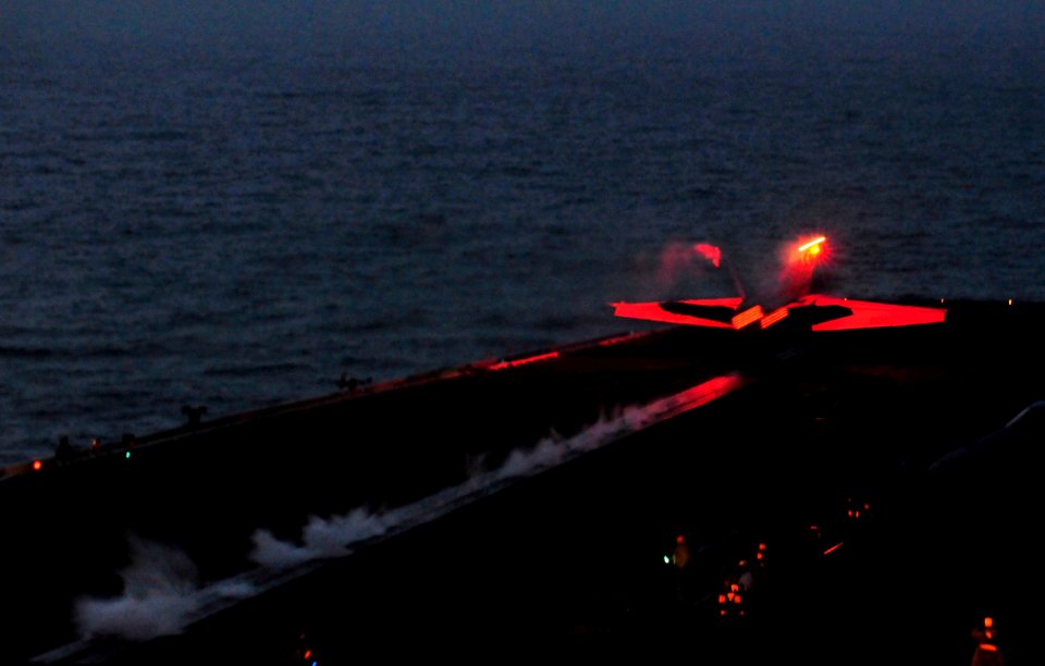 US Navy 100306-N-3595W-001 An F-A-18F Super Hornet launches from the Nimitz-class aircraft carrier USS Dwight D. Eisenhower (CVN 69) during night flight operations