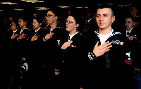US Navy 100308-N-7280V-224 Sailors recite the pledge of allegiance as they become U.S. citizens during a naturalization ceremony aboard the U.S. 7th Fleet command ship USS Blue Ridge (LCC 19)