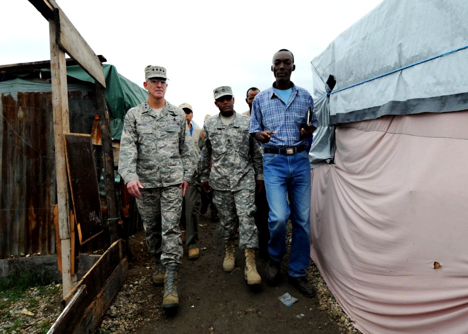 US Navy 100306-N-5961C-013 Gen. Douglas Fraser, left, commander of U.S. Southern Command, tours the Camp Ancien internally displaced person's camp in Port-au-Prince, Haiti