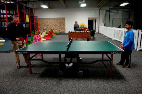 US Navy 100308-N-9818V-392 Master Chief Petty Officer of the Navy (MCPON) Rick West plays ping pong during a tour of Naval Air Station Whidbey Island photo