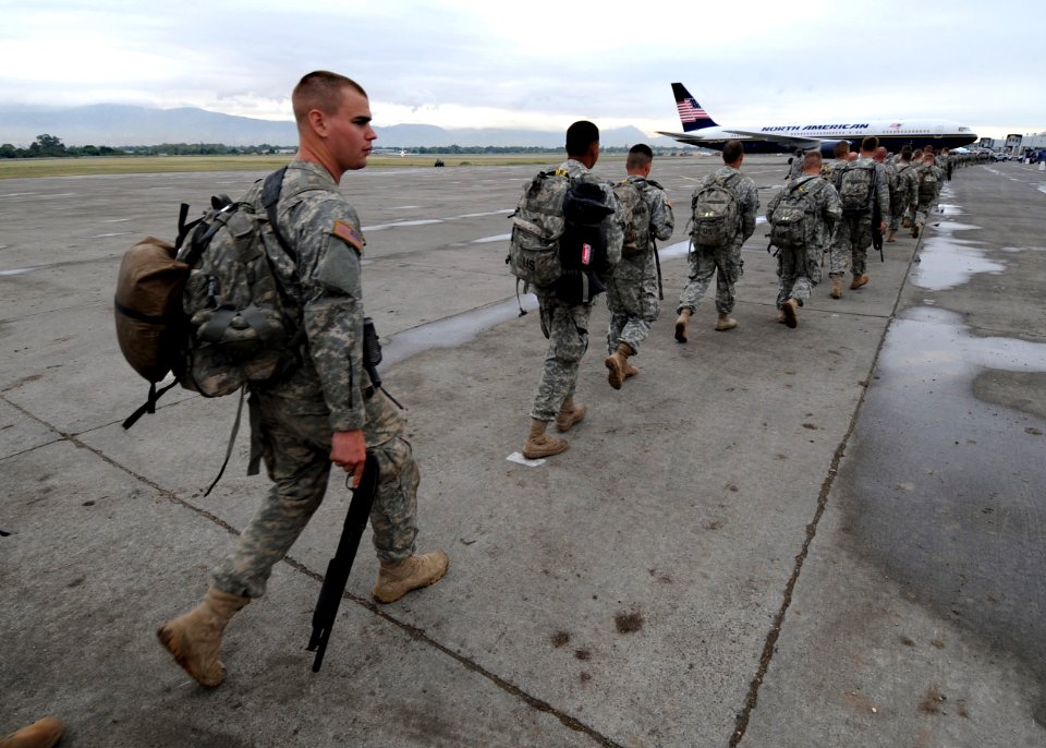 US Navy 100306-N-5961C-006 Soldiers assigned to the 82nd Airborne Division board a plane to return to Fort Bragg, N.C. after completing a humanitarian assistance deployment supporting Operation Unified Response