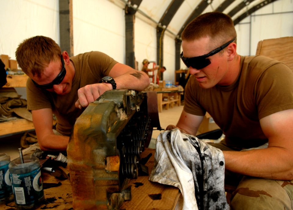 US Navy 100308-N-4440L-020 Construction Mechanic Constructionman Apprentice William Houston, left, from Victor, Mont., and Construction Mechanic Constructionman Gregory Allam, from Albany, Ore