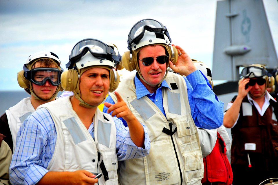 US Navy 100307-N-2953W-606 Ambassador David Nelson, U.S. Ambassador to Uruguay, right, watches an F-A-18 Super Hornet strike fighter land aboard the aircraft carrier USS Carl Vinson (CVN 70)