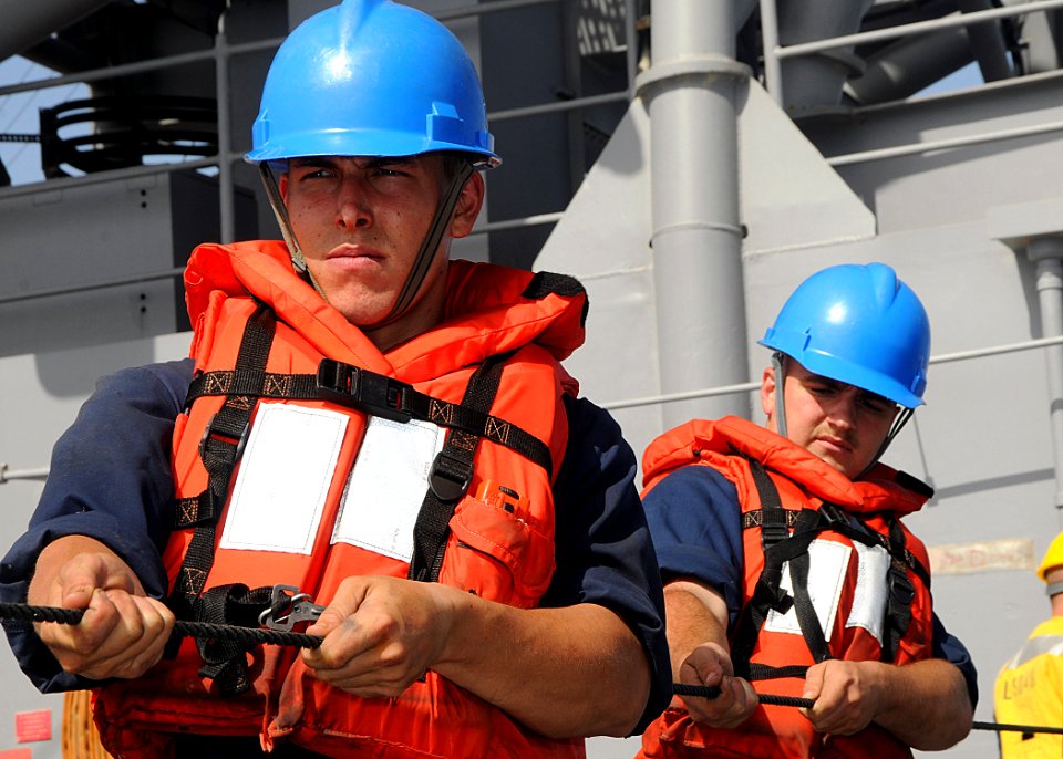 US Navy 100310-N-1082Z-021 Boatswain's Mate Seaman Mathew A. Parsons, from Raleigh, N.C., and Seaman David M. Hudson, from Lynchburg, Va., handle the phone and distance line