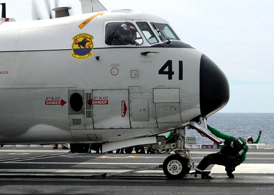 US Navy 100307-N-3885H-053 An air department Sailor prepares a C-2A Greyhound assigned to Fleet Logistics Support Squadron (VRC) 40 for launch during flight operations aboard the aircraft carrier USS George H.W. Bush (CVN 77)