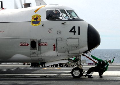 US Navy 100307-N-3885H-053 An air department Sailor prepares a C-2A Greyhound assigned to Fleet Logistics Support Squadron (VRC) 40 for launch during flight operations aboard the aircraft carrier USS George H.W. Bush (CVN 77)