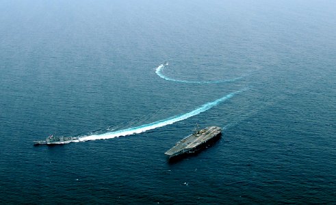 US Navy 100308-N-0808V-602 USS Bunker Hill (CG 52) and the Argentina navy frigate ARA Gomez Roca (P 46) break away from USS Carl Vinson (CVN 70) after completing tactical maneuvering exercises