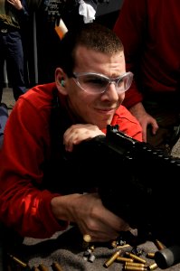 US Navy 100308-N-3038W-114 Aviation Ordnanceman Airman Benjamin McCombs, from Wesley Chapel, Fla., fires an M-240B machine gun during a live-fire exercise aboard the aircraft carrier USS Nimitz (CVN 68)