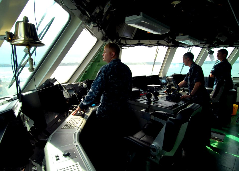 US Navy 100308-N-7058E-084 Chief Hospital Corpsman Joseph Dennis, Lt. Todd Sehl and Cmdr. Randy Garner watch from the bridge of USS Freedom (LCS 1) as the ship enters the port of Colon, Panama