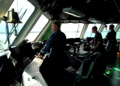 US Navy 100308-N-7058E-084 Chief Hospital Corpsman Joseph Dennis, Lt. Todd Sehl and Cmdr. Randy Garner watch from the bridge of USS Freedom (LCS 1) as the ship enters the port of Colon, Panama
