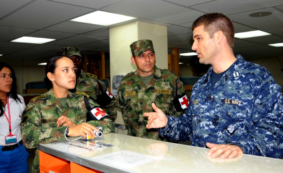 US Navy 100308-N-6410J-985 Lt. Jorge Gonzalez, from Miami, Fla., describes pediatric treatment procedures to a visiting Colombian delegation aboard the Military Sealift Command hospital ship USNS Comfort (T-AH 20)