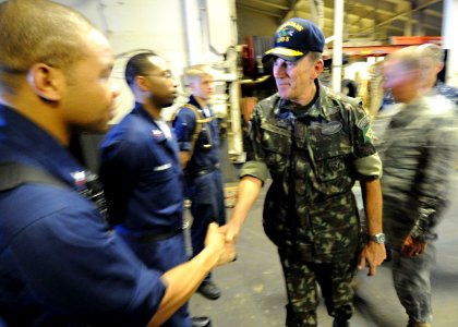 US Navy 100311-N-5961C-019 Brazilian army Maj. Gen. Floriano Peixoto Vieira Neto, right, force commander of the U.N. Stabilization Mission in Haiti, meets with Sailors aboard the amphibious assault ship USS Bataan (LHD 5)