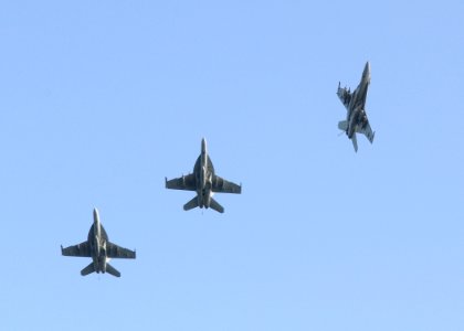 US Navy 100309-N-4236E-296 An F-A-18E Super Hornet breaks away from the group before landing aboard USS Dwight D. Eisenhower (CVN 69)