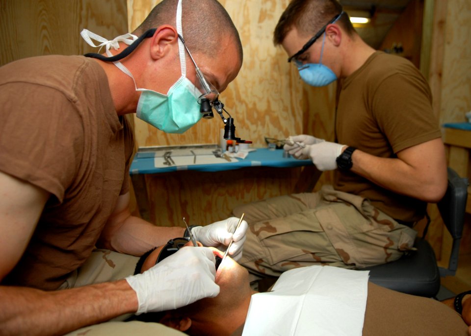 US Navy 100309-N-4440L-037 Lt. Paul Gundy, from Diamondhead, Miss., left, and Hospital Corpsman 3rd Class Steven Wade, from Sanford, N.C.,