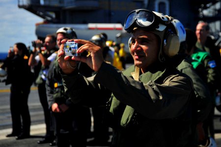 US Navy 100310-N-2953W-287 Argentinian visitors watch an F-A-18 Super Hornet take off from USS Carl Vinson (CVN 70)
