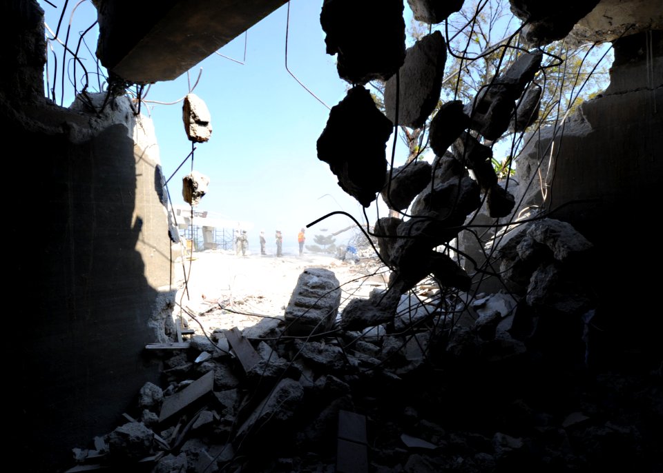 US Navy 100312-N-5961C-006 Seabees assigned to Navy Mobile Construction Battalion (NMCB) 7 clear rubble and rebar from the demolished Hotel Montana, the former four-star hotel in Port-au-Prince, Haiti