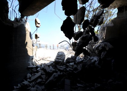 US Navy 100312-N-5961C-006 Seabees assigned to Navy Mobile Construction Battalion (NMCB) 7 clear rubble and rebar from the demolished Hotel Montana, the former four-star hotel in Port-au-Prince, Haiti