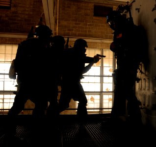 US Navy 100308-N-7498L-028 Pearl Harbor-based Sailors navigate through the advanced Security Reaction Force course scenarios at the Center for Security Forces, Pearl Harbor learning site