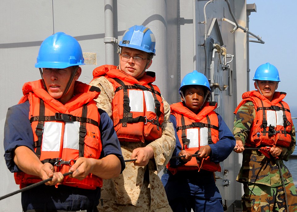 US Navy 100310-N-1082Z-008 Sailors and Marines handle the phone and distance line to the Military Sealift Command fast combat support ship USNS Supply (T-AOE 6) during a replenishment at sea