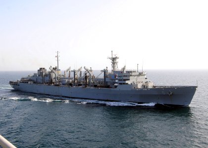US Navy 100310-N-1082Z-050 The Military Sealift Command fast combat support ship USNS Supply (T-AOE 6) departs after conducting a replenishment at sea with the amphibious dock landing ship USS Ashland (LSD 48)