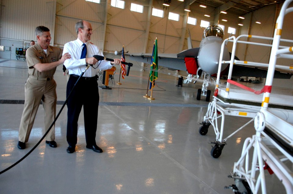 US Navy 100308-N-9818V-365 Master Chief Petty Officer of the Navy (MCPON) Rick West and Congressman Rick Larson cut the ribbon during the washrack ribbon cutting ceremony at Naval Air Station Whidbey Island