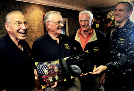 US Navy 100310-N-3595W-007 Astronaut legend Neil Armstrong is presented with honorary Naval Astronaut Wings by Capt. Dee L. Mewbourne, commanding officer of the aircraft carrier USS Dwight D. Eisenhower (CVN 69)