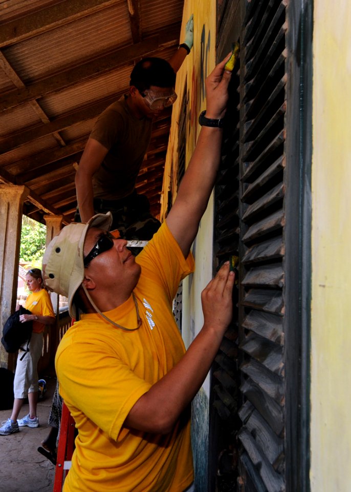 US Navy 100311-N-6676S-070 Engineman Fireman Roberto Martinez, from San Diego, cleans shutters at St. Theresa's Early Childhood Development Centre