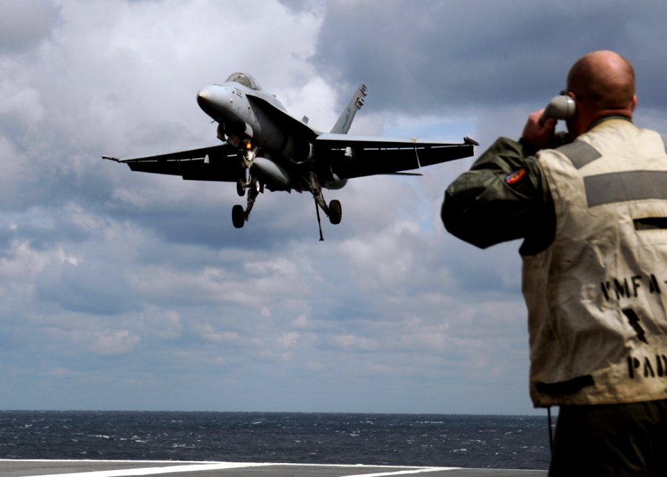 US Navy 100314-N-9116S-731 An F-A-18C Hornet assigned to Strike Fighter Squadron (VFA) 106 lands aboard the aircraft carrier USS George H.W. Bush (CVN 77)