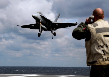 US Navy 100314-N-9116S-731 An F-A-18C Hornet assigned to Strike Fighter Squadron (VFA) 106 lands aboard the aircraft carrier USS George H.W. Bush (CVN 77) photo