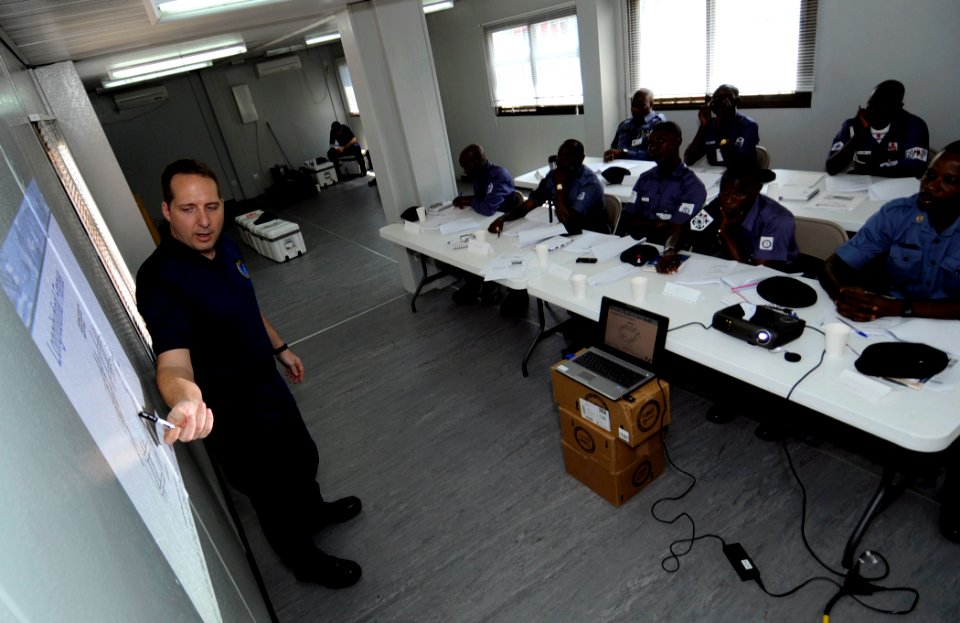 US Navy 100311-N-7948C-106 Coast Guard Chief Warrant Officer 3 Earl Schlemmer conducts a basic small-boat operation seminar with Ghanaian, Nigerian, and Benin sailors