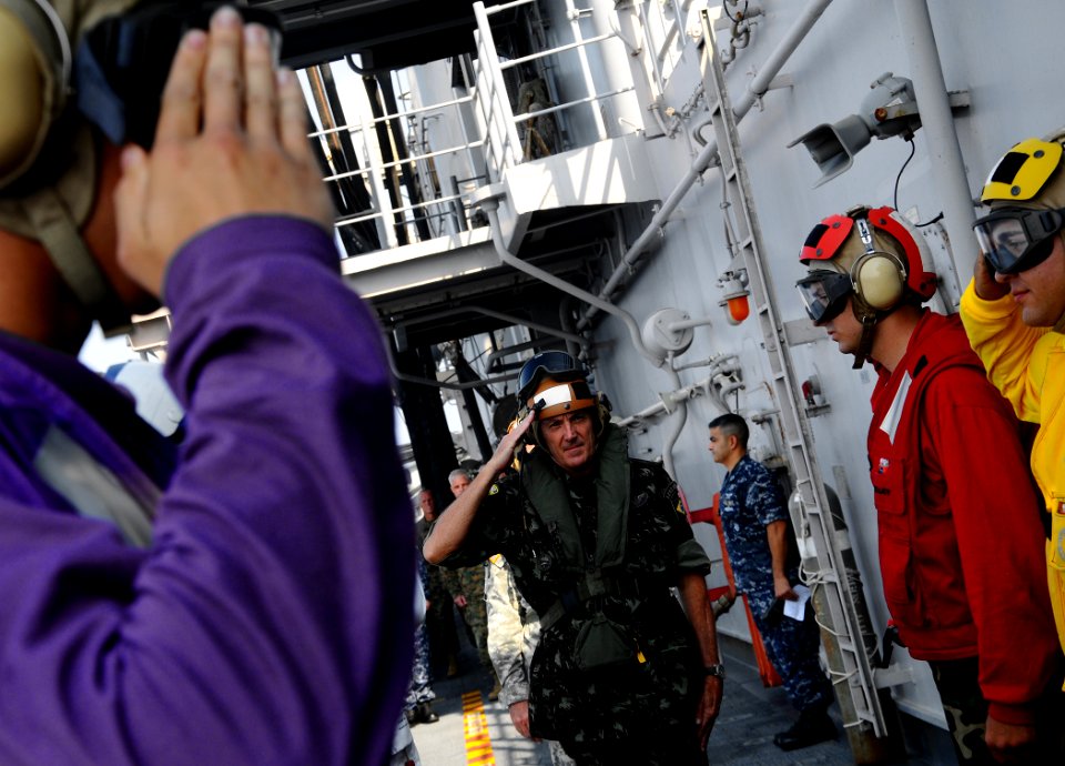 US Navy 100311-N-8655E-025 Brazilian army Maj. Gen. Floriano Peixoto Vieira Neto salutes the sideboys as he departs the multipurpose amphibious assault ship USS Bataan (LHD 5)