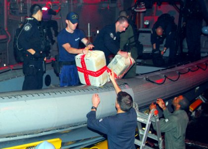 US Navy 100312-N-7058E-035 Sailors and Coast Guardsmen from the littoral combat ship USS Freedom (LCS 1) unload bales of cocaine dumped overboard by a small boat intercepted by Freedom