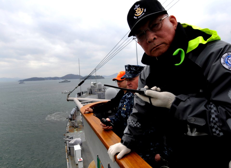 US Navy 100312-N-7280V-174 A harbor pilot guides U.S. 7th Fleet command ship USS Blue Ridge (LCC 19) through the harbor of Chinhae Naval Base