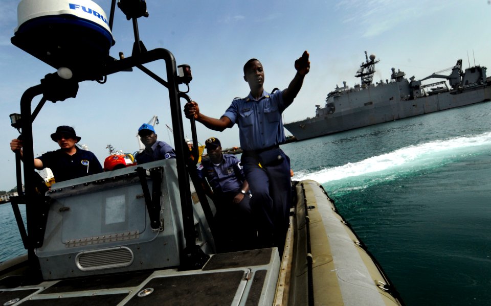 US Navy 100315-N-7948C-088 Ghana navy Chief Petty Officer Akakpo Cudjoe points in the direction of a life ring