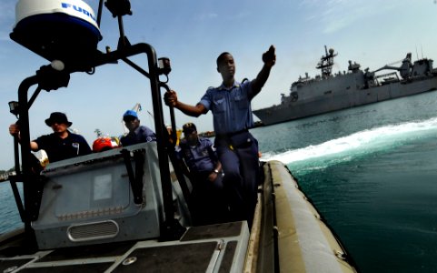 US Navy 100315-N-7948C-088 Ghana navy Chief Petty Officer Akakpo Cudjoe points in the direction of a life ring photo
